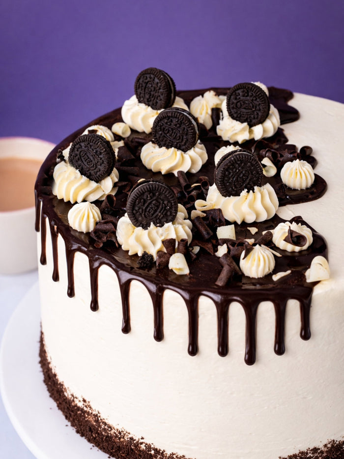 Close view of the ganache, cream swirls and biscuits topping the Cookies and Cream Cake