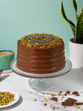 Dubai Style Chocolate Cake with a pistachio crumb ring and feathered chocolate top