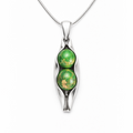 Silver pendant with green gemstones on a white background